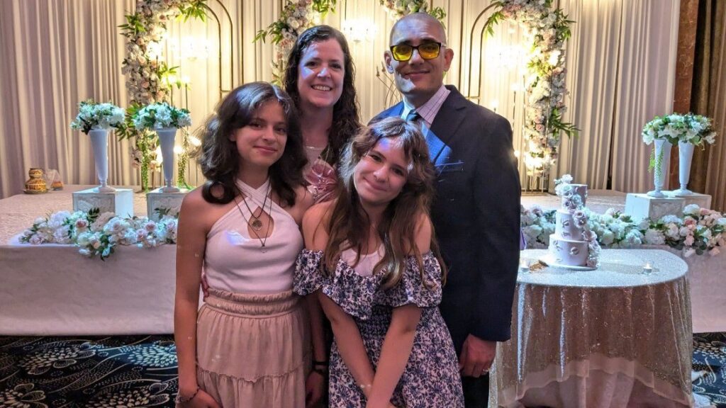 Family posing at an elegant floral celebration